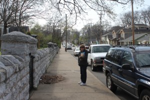Tourist on the sidewalk in front of the Uhlian House