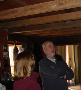 Ed Emberley shows Peggy the original beams placed by Reginald Foster and sons in the 1640s